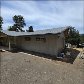 Repainted home exterior with clean trim work